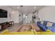 Bright living room boasting hardwood floors, modern furniture, and an open-concept design connected to the kitchen at 1918 W 165Th Way, Broomfield, CO 80023
