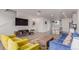 Stylish living room featuring hardwood floors, a comfortable blue sofa, and an open layout with natural light at 1918 W 165Th Way, Broomfield, CO 80023