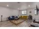 Bright and airy living room featuring hardwood floors, modern furnishings, and ample natural light at 1918 W 165Th Way, Broomfield, CO 80023