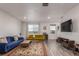 Spacious living room featuring hardwood floors, stylish furniture, and modern decor at 1918 W 165Th Way, Broomfield, CO 80023