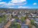 Vast aerial perspective capturing the sprawling neighborhood under a bright blue sky at 6260 Lamar St, Arvada, CO 80003
