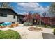 Backyard featuring a stone patio with comfortable seating options, landscaping, and plenty of room to entertain at 6260 Lamar St, Arvada, CO 80003