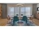 Dining area featuring large windows, stylish lighting, and comfortable seating at 6260 Lamar St, Arvada, CO 80003