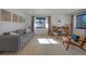 Spacious living room filled with natural light, featuring a comfortable sofa, and modern decor at 6260 Lamar St, Arvada, CO 80003