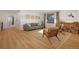 Inviting living room with hardwood floors, a comfortable sofa, and stylish furnishings at 6260 Lamar St, Arvada, CO 80003