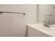 Bathroom featuring modern sink, vanity, and brushed metal towel bar at 1811 S Quebec Way # 31, Denver, CO 80231