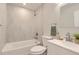 Modern bathroom with a tub-shower, marbled tile, and contemporary fixtures and decor at 1811 S Quebec Way # 31, Denver, CO 80231