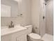 Updated bathroom with marbled tile shower, white vanity, and brushed nickel fixtures at 1811 S Quebec Way # 31, Denver, CO 80231