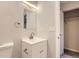 Bathroom with modern vanity, brushed nickel fixtures, and a closet for extra storage at 1811 S Quebec Way # 31, Denver, CO 80231