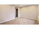 Bright bedroom features neutral walls, plush carpet, and a closet for ample storage at 1811 S Quebec Way # 31, Denver, CO 80231