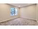 Bright bedroom features neutral walls, plush carpet, and a large window letting in ample light at 1811 S Quebec Way # 31, Denver, CO 80231