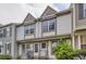 Attractive townhome exterior with detailed trim and a tidy front yard at 1811 S Quebec Way # 31, Denver, CO 80231
