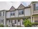 Charming two-story townhome exterior with decorative trim and well-maintained landscaping at 1811 S Quebec Way # 31, Denver, CO 80231