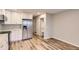 Bright kitchen featuring stainless steel refrigerator, white cabinets and modern flooring at 1811 S Quebec Way # 31, Denver, CO 80231