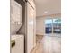 Cozy laundry area with stacked washer/dryer unit and a sliding door to the back patio at 1811 S Quebec Way # 31, Denver, CO 80231