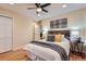 Inviting bedroom with a ceiling fan, closet, and doorway leading to other rooms at 26732 Main St, Conifer, CO 80433