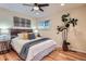 Comfortable bedroom showcasing a rustic headboard, stylish decor, and hardwood floors at 26732 Main St, Conifer, CO 80433