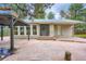 Charming home featuring a flagstone walkway, covered front porch, and well maintained landscaping at 26732 Main St, Conifer, CO 80433