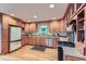 Kitchen with light wood cabinetry, stainless steel appliances, and hardwood flooring at 26732 Main St, Conifer, CO 80433
