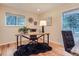 Bright office space with a rustic wood desk, hardwood floors, and natural light at 26732 Main St, Conifer, CO 80433