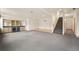 Large basement featuring stairs and a wet bar, ideal for entertainment and relaxation at 1942 Kentmere Dr, Longmont, CO 80504