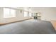 Spacious basement area with a wet bar, sink, and wine fridge for entertaining at 1942 Kentmere Dr, Longmont, CO 80504