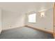 Bedroom with a window for natural light, neutral walls, and neutral carpeting at 1942 Kentmere Dr, Longmont, CO 80504