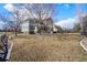 Charming home featuring a spacious front yard and beautiful architectural details at 1942 Kentmere Dr, Longmont, CO 80504