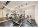 Home gym equipped with various exercise machines and mirrored walls for workout enthusiasts at 1942 Kentmere Dr, Longmont, CO 80504