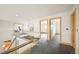 Upstairs hallway with glass railing leading to bedrooms; plenty of natural light creates a spacious atmosphere at 1942 Kentmere Dr, Longmont, CO 80504