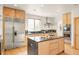 Modern kitchen features granite countertops, stainless steel appliances, and center island at 1942 Kentmere Dr, Longmont, CO 80504