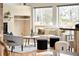 Cozy living room featuring a modern fireplace, stylish seating, and bright windows at 1942 Kentmere Dr, Longmont, CO 80504