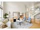 Open living room features high ceilings, hardwood floors, and seamless flow to the kitchen at 1942 Kentmere Dr, Longmont, CO 80504