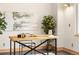 Bright office space featuring a modern desk, stylish decor, and ample natural light at 1942 Kentmere Dr, Longmont, CO 80504