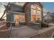 Side view of house showing outdoor patio with built-in stainless steel grill and view of the house at 1942 Kentmere Dr, Longmont, CO 80504