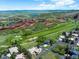 Gorgeous aerial view of home situated on the golf course with mountain views and lakes at 6405 Warriors Run, Littleton, CO 80125