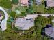 The home features a meticulously landscaped yard surrounded by mature trees at 6405 Warriors Run, Littleton, CO 80125