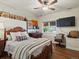 Cozy bedroom features a ceiling fan, and a large window at 6405 Warriors Run, Littleton, CO 80125