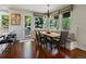 Inviting breakfast nook with hardwood floors, a banquette, and large windows overlooking the backyard at 6405 Warriors Run, Littleton, CO 80125