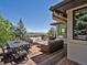 The outdoor deck space includes a fire pit, comfortable seating, and mountain views at 6405 Warriors Run, Littleton, CO 80125