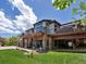 Expansive exterior features multiple decks and stone and siding accents at 6405 Warriors Run, Littleton, CO 80125