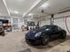 The garage features ample storage and parking space at 6405 Warriors Run, Littleton, CO 80125
