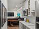 Bright, open kitchen layout flows into the living room at 6405 Warriors Run, Littleton, CO 80125
