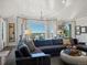 Bright and spacious living room with a large sectional couch and incredible views at 6405 Warriors Run, Littleton, CO 80125