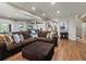 Open living room layout with hard floors and a comfortable couch at 6405 Warriors Run, Littleton, CO 80125