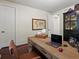 Office with hardwood floors, a large desk, and a comfortable chair at 6405 Warriors Run, Littleton, CO 80125