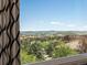 Expansive view of the golf course and mountains from the home's window at 6405 Warriors Run, Littleton, CO 80125