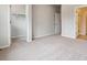 Spacious bedroom featuring plush carpeting, neutral walls and a walk-in closet at 451 Interlocken Blvd # 104, Broomfield, CO 80021