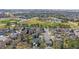 Overhead view of the community featuring well-maintained homes, green spaces, a pool, and easy access to nearby amenities at 10240 Travertine Pl, Parker, CO 80134