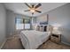 Bright bedroom with neutral colors, ceiling fan, and lots of natural light at 10240 Travertine Pl, Parker, CO 80134